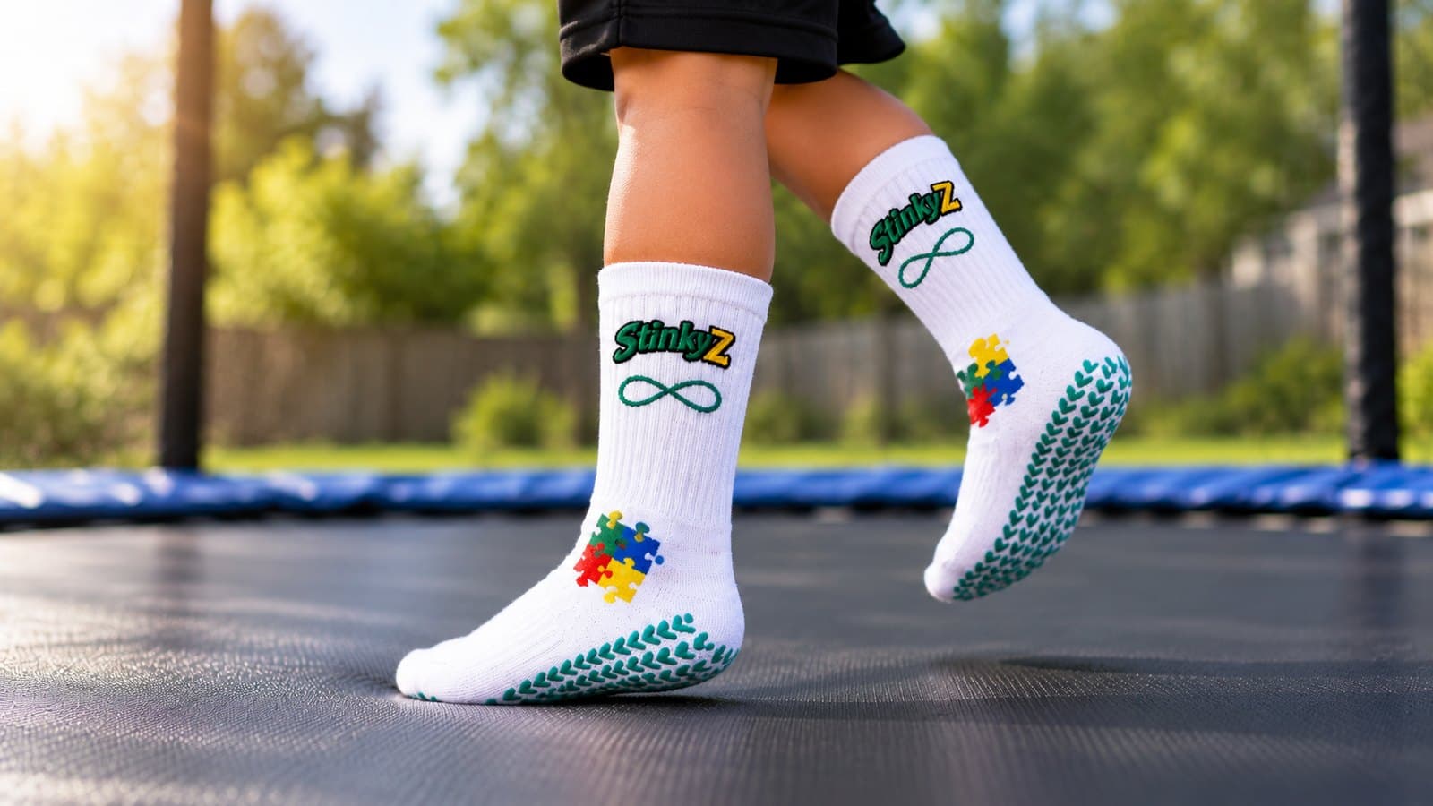 A child on a trampoline wearing StinkyZ Autism Awareness grip socks